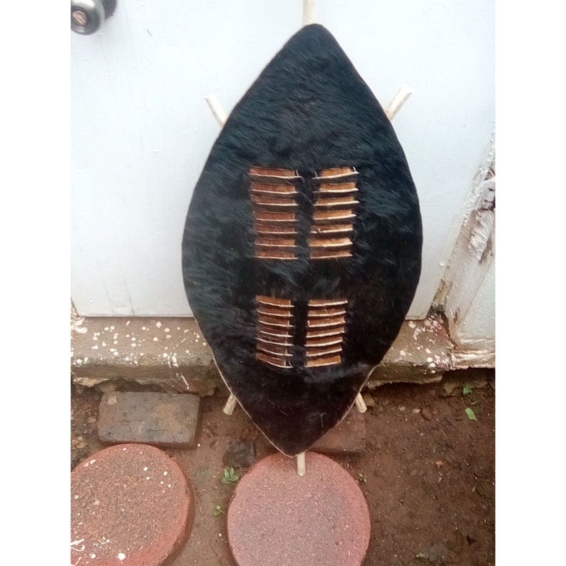 zulu african traditional cultural shield, african warrior hat, african warrior shield and hat made of cowhide (ihawu)